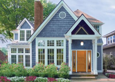 a blue house with installed windows