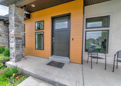 a house with a black front door and windows