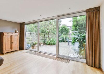 a house with modern sliding glass doors