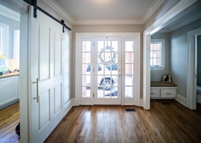 a house with side entry door with two sidelights